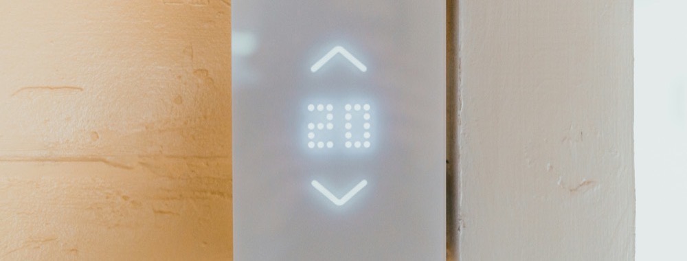 Wall thermostat being configured