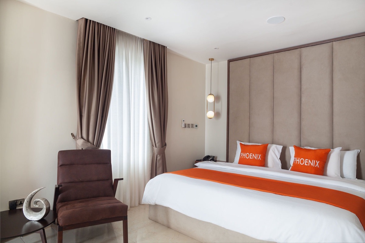 Smart hotel room installation with ceiling audio and lighting control