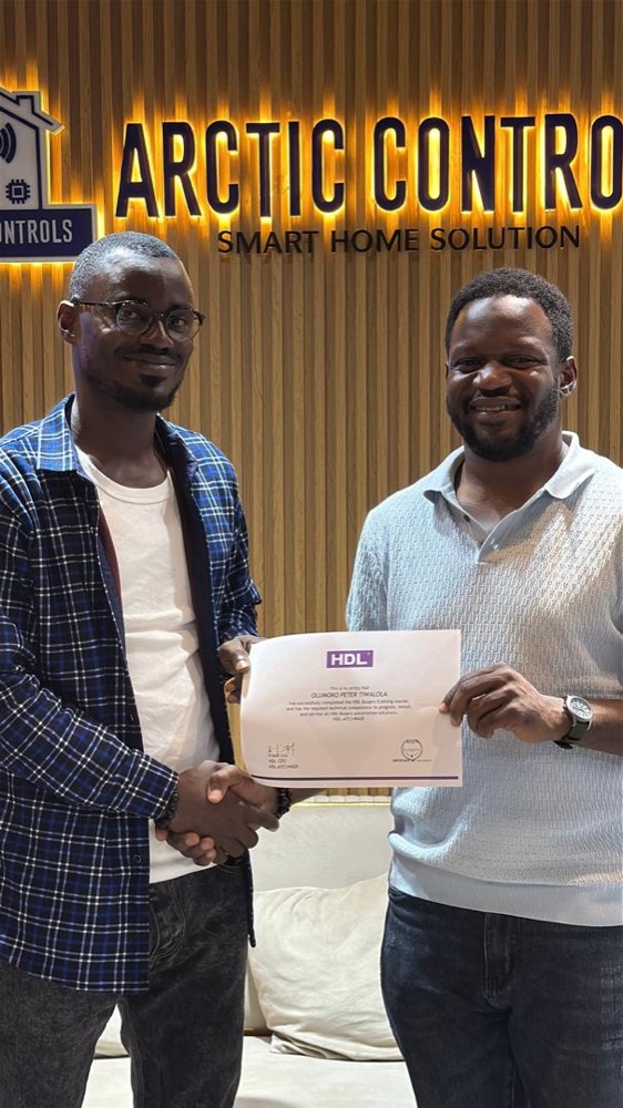 Trainee receiving an HDL Buspro certificate at Arctic Controls