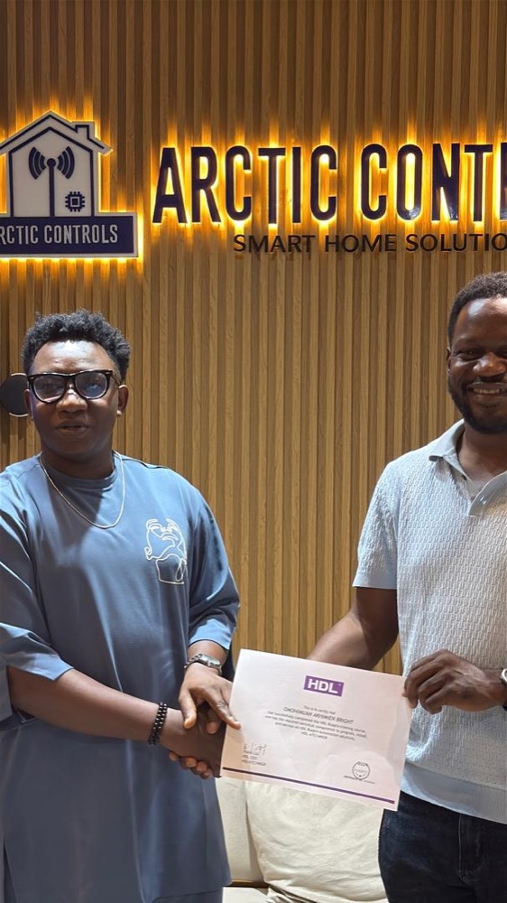Trainee receiving an HDL Buspro training certificate at Arctic Controls